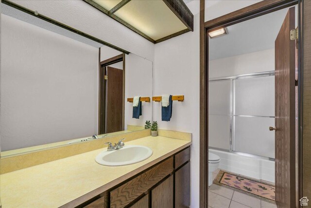 407 S Vasels Rd Unit 27, Brian Head, UT 84719 - full bathroom with toilet, vanity, bath / shower combo with glass door, and tile patterned floors