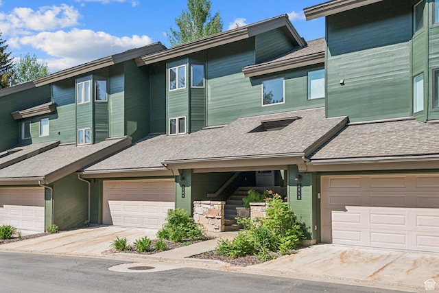 1709 Lakeside Cir, Park City, UT 84060 - view of property with a shingled roof and driveway