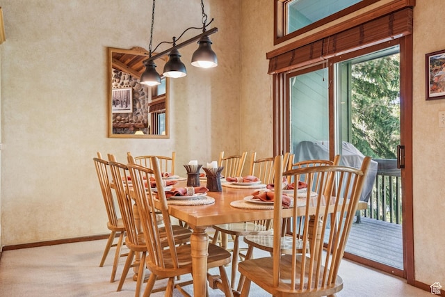 1709 Lakeside Cir, Park City, UT 84060 - carpeted dining space featuring baseboards, a textured wall, and a towering ceiling