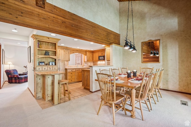 1709 Lakeside Cir, Park City, UT 84060 - dining area with light carpet, recessed lighting, baseboards, and a towering ceiling
