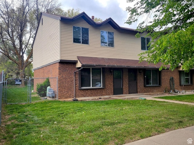 151 E Southwell St N Unit 9, Ogden, UT 84404 - townhome / multi-family property featuring brick siding and a gate