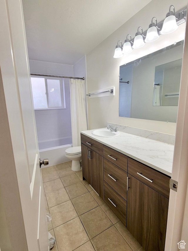 151 E Southwell St N Unit 9, Ogden, UT 84404 - full bathroom featuring vanity, tile patterned floors, toilet, and shower / bath combination with curtain