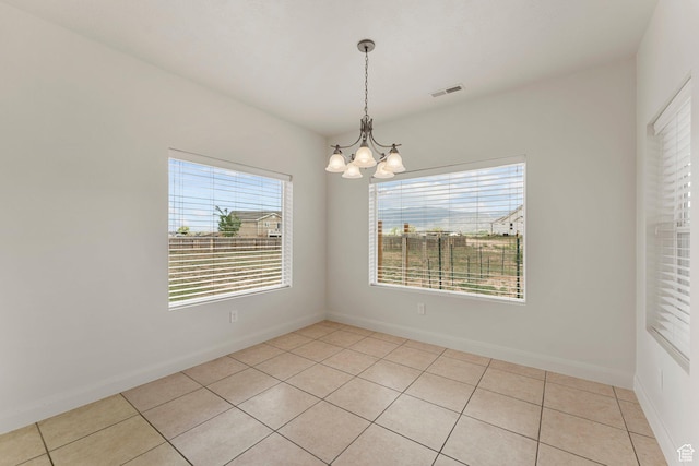 4236 N 2375 W, Cedar City, UT 84721 - spare room featuring a chandelier, light tile patterned flooring, and baseboards