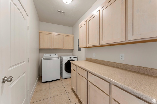 4236 N 2375 W, Cedar City, UT 84721 - washroom featuring washing machine and clothes dryer, cabinet space, light tile patterned floors, and baseboards