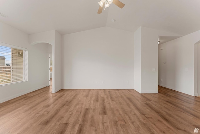 4236 N 2375 W, Cedar City, UT 84721 - unfurnished room with arched walkways, a ceiling fan, light wood-style floors, baseboards, and vaulted ceiling