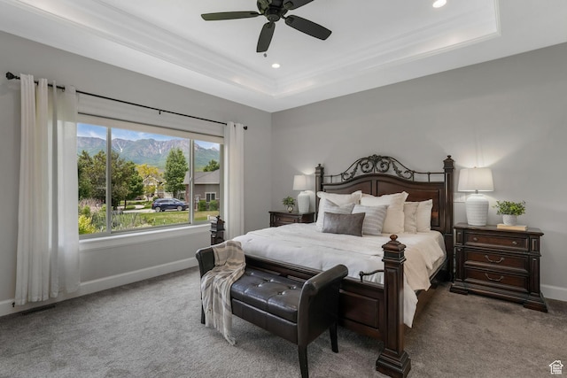6035 Hidden Valley Rd, Mountain Green, UT 84050 - carpeted bedroom featuring a tray ceiling, a mountain view, recessed lighting, baseboards, and a ceiling fan