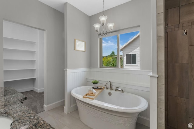 6035 Hidden Valley Rd, Mountain Green, UT 84050 - bathroom featuring a freestanding tub, a chandelier, a wainscoted wall, and vanity