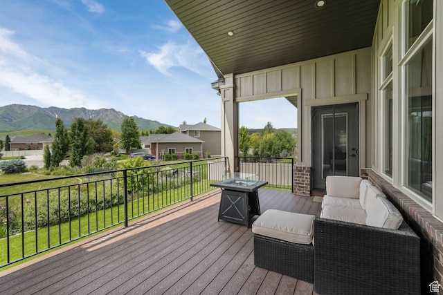 6035 Hidden Valley Rd, Mountain Green, UT 84050 - deck featuring a mountain view and a fire pit
