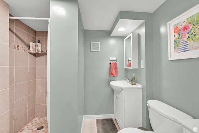 490 N 300 E, Kaysville, UT 84037 - bathroom with vanity, tile patterned floors, tiled shower, toilet, and baseboards