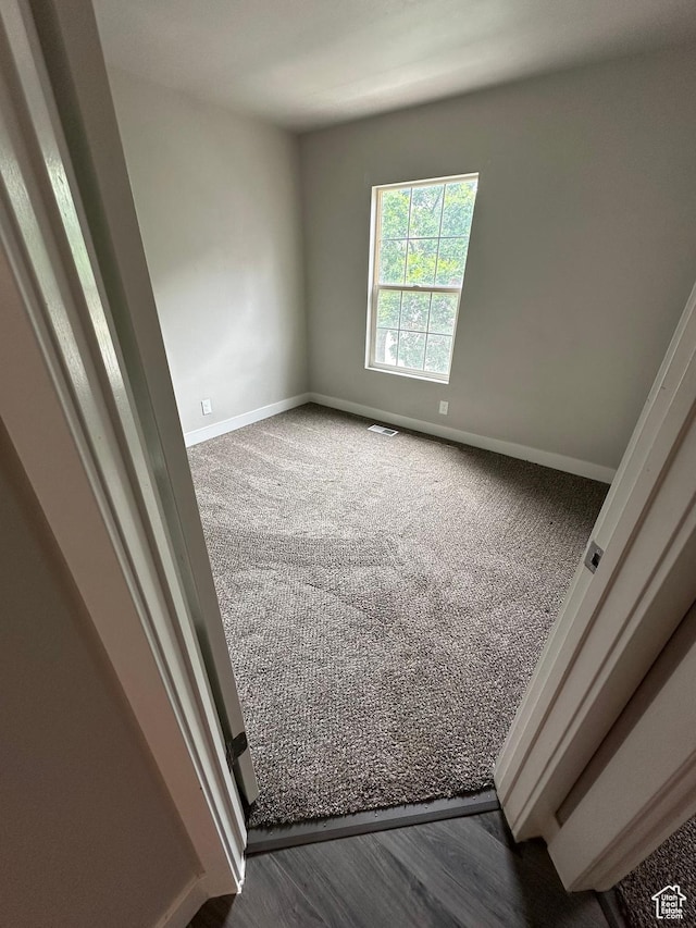 39 W 1930 N, Tooele, UT 84074 - unfurnished room featuring baseboards and dark carpet