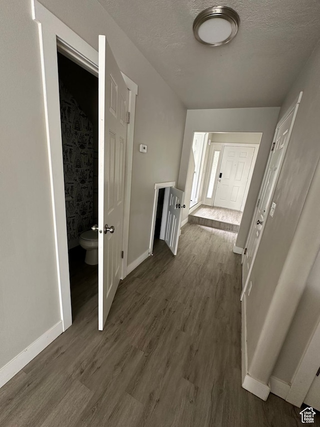 39 W 1930 N, Tooele, UT 84074 - hallway featuring dark wood-style flooring, baseboards, and a textured ceiling