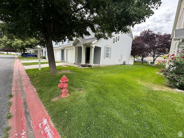 39 W 1930 N, Tooele, UT 84074 - view of front of house with a garage, a front lawn, and driveway