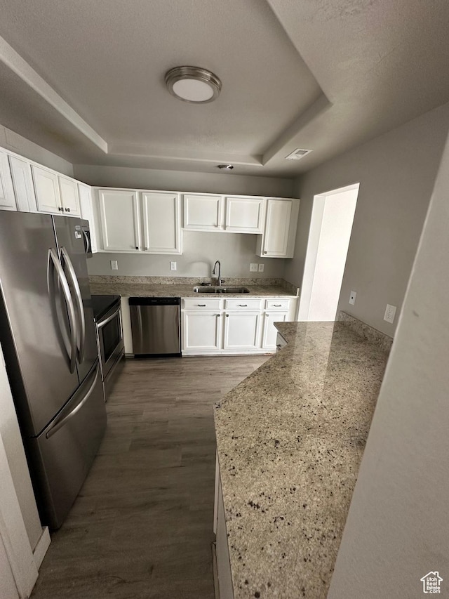 39 W 1930 N, Tooele, UT 84074 - kitchen with appliances with stainless steel finishes, a sink, white cabinets, and light stone counters