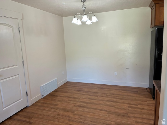 1045 S 1700 W Unit 912, Payson, UT 84651 - unfurnished dining area featuring a chandelier, dark wood-style flooring, and a textured ceiling