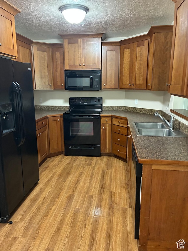 1045 S 1700 W Unit 912, Payson, UT 84651 - kitchen featuring black appliances, a textured ceiling, and brown cabinetry