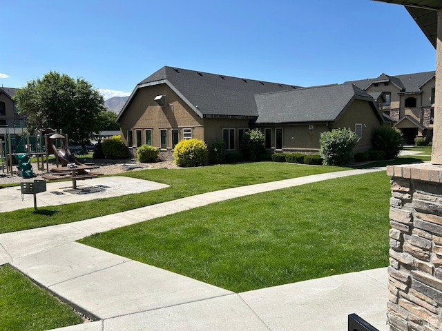 1045 S 1700 W Unit 912, Payson, UT 84651 - view of front of house featuring a playground and a front lawn