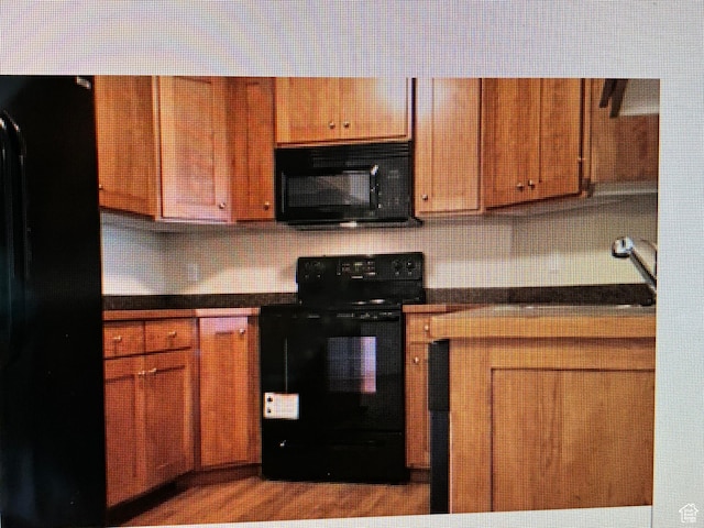 1045 S 1700 W Unit 912, Payson, UT 84651 - kitchen with electric range, dark countertops, decorative backsplash, and brown cabinets