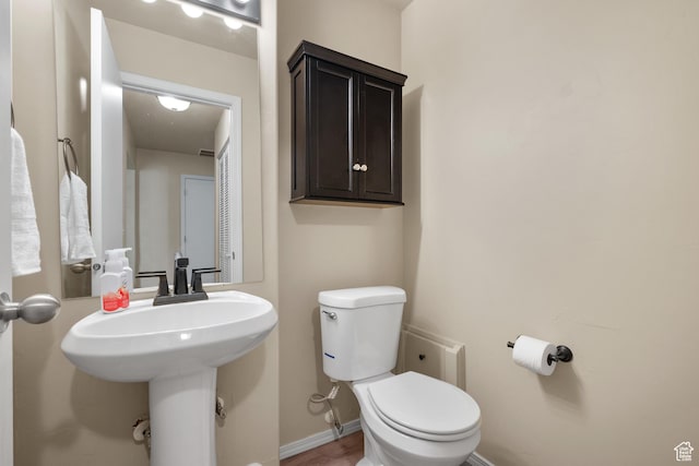 1722 N 80 E, Tooele, UT 84074 - half bathroom with toilet, baseboards, and a sink