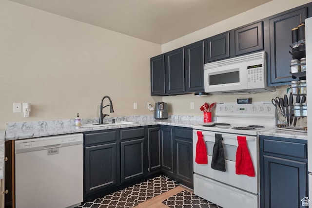 1722 N 80 E, Tooele, UT 84074 - kitchen featuring white appliances, a sink, and light countertops