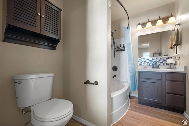 1722 N 80 E, Tooele, UT 84074 - bathroom featuring vanity, shower / tub combo, toilet, wood finished floors, and baseboards