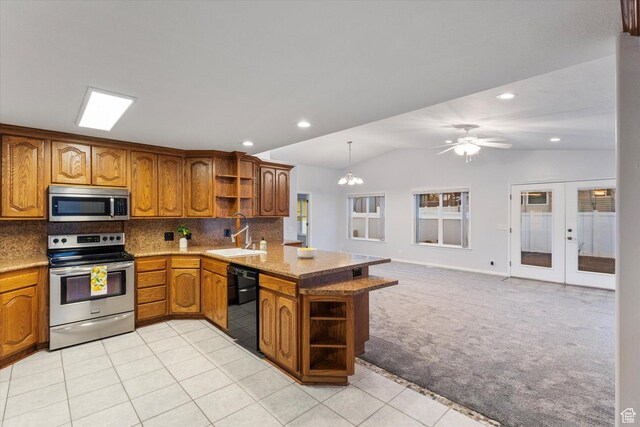 10865 S Granite Dr, Sandy, UT 84094 - kitchen featuring open shelves, stainless steel appliances, a sink, brown cabinets, and a peninsula