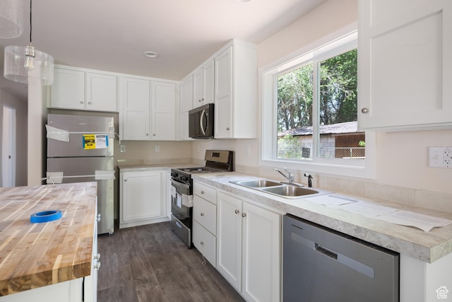 30 N 100 W, Parowan, UT 84761 - kitchen featuring stainless steel appliances, wood counters, a sink, dark wood-type flooring, and white cabinetry