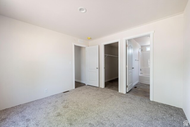 30 N 100 W, Parowan, UT 84761 - unfurnished bedroom featuring carpet flooring, a walk in closet, a closet, and ensuite bathroom