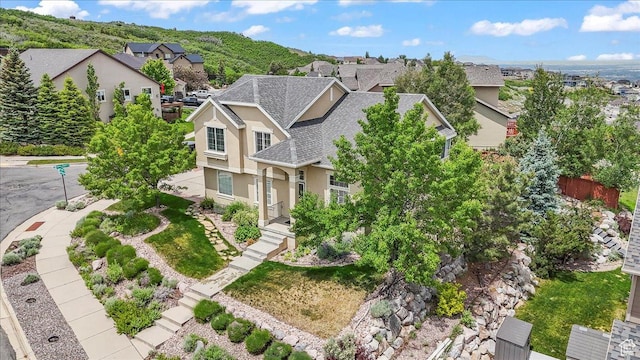 2167 E Eagle Chase Dr, Draper Ut Cnty, UT 84020 - view of front of house with a shingled roof, stucco siding, and a residential view