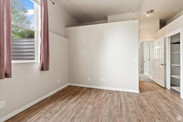2167 E Eagle Chase Dr, Draper Ut Cnty, UT 84020 - empty room featuring wood finished floors and baseboards