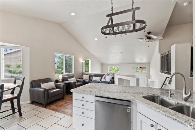 2167 E Eagle Chase Dr, Draper Ut Cnty, UT 84020 - kitchen featuring stainless steel dishwasher, a sink, vaulted ceiling, plenty of natural light, and a ceiling fan