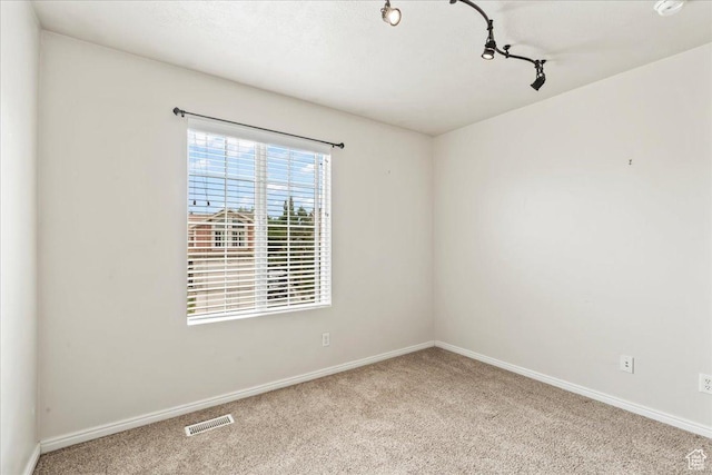 2167 E Eagle Chase Dr, Draper Ut Cnty, UT 84020 - carpeted empty room with baseboards and rail lighting