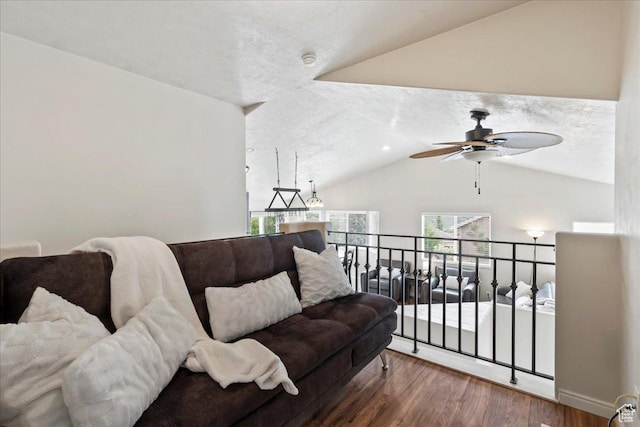 2167 E Eagle Chase Dr, Draper Ut Cnty, UT 84020 - living room with wood finished floors, vaulted ceiling, a ceiling fan, and a textured ceiling