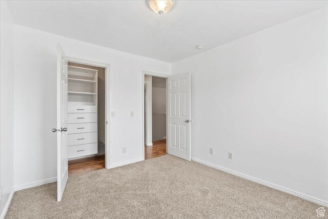 2167 E Eagle Chase Dr, Draper Ut Cnty, UT 84020 - unfurnished bedroom with carpet floors, baseboards, a spacious closet, and a closet