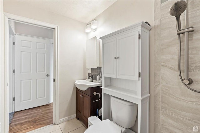 2167 E Eagle Chase Dr, Draper Ut Cnty, UT 84020 - bathroom with vanity, toilet, a tile shower, and tile patterned floors