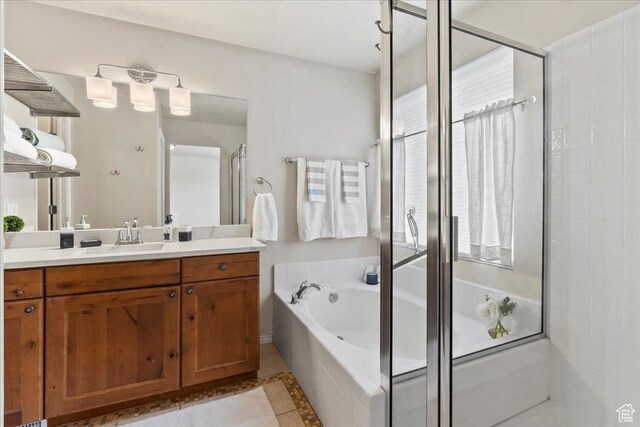 2167 E Eagle Chase Dr, Draper Ut Cnty, UT 84020 - bathroom featuring vanity, a stall shower, a bath, inlaid floor details, and tile patterned flooring