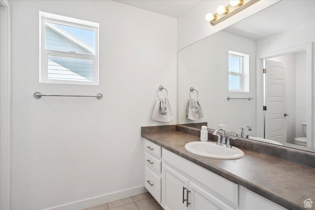 3278 S Boots Way, Syracuse, UT 84075 - bathroom with vanity, toilet, tile patterned floors, and baseboards