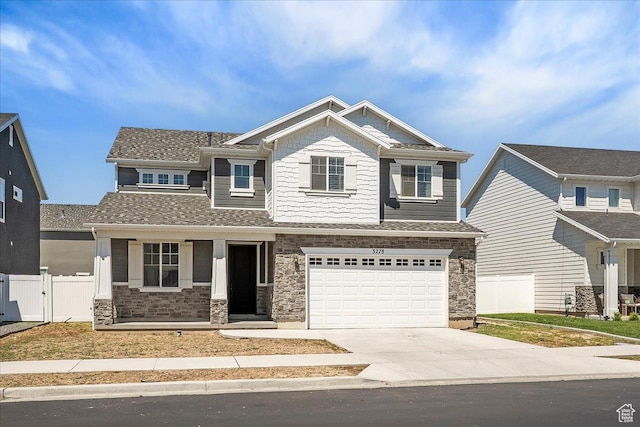 3278 S Boots Way, Syracuse, UT 84075 - craftsman house with concrete driveway, a garage, stone siding, and a porch
