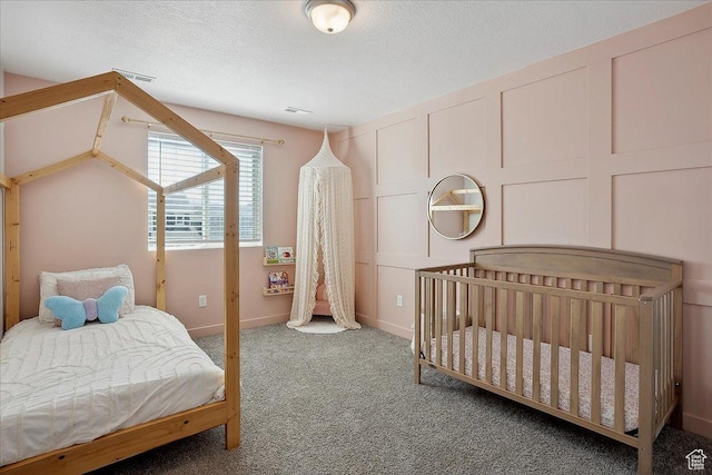 3278 S Boots Way, Syracuse, UT 84075 - bedroom featuring carpet flooring, a decorative wall, a textured ceiling, and baseboards