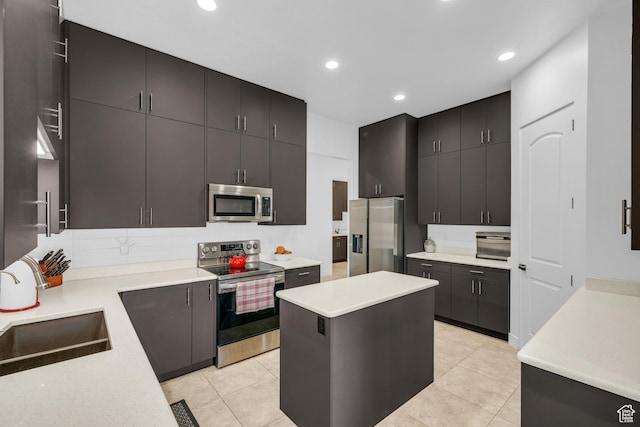 1226 W Province Way, St George, UT 84770 - kitchen featuring stainless steel appliances, light countertops, recessed lighting, a sink, and light tile patterned floors