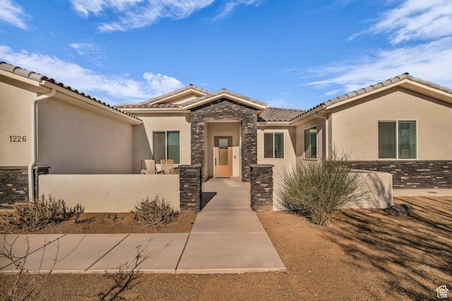 1226 W Province Way, St George, UT 84770 - view of front of house featuring stone siding, stucco siding, and a tile roof