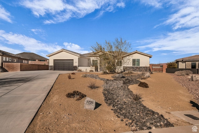 1226 W Province Way, St George, UT 84770 - ranch-style home featuring stone siding, driveway, stucco siding, and a garage