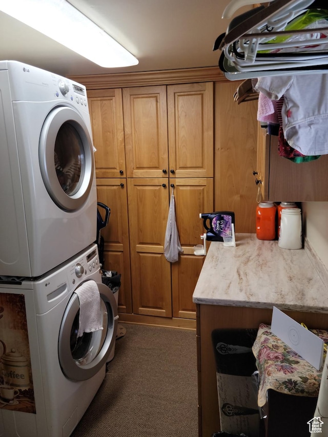 83 E Miners St, Ophir, UT 84071 - laundry room featuring stacked washer / dryer, cabinet space, and carpet