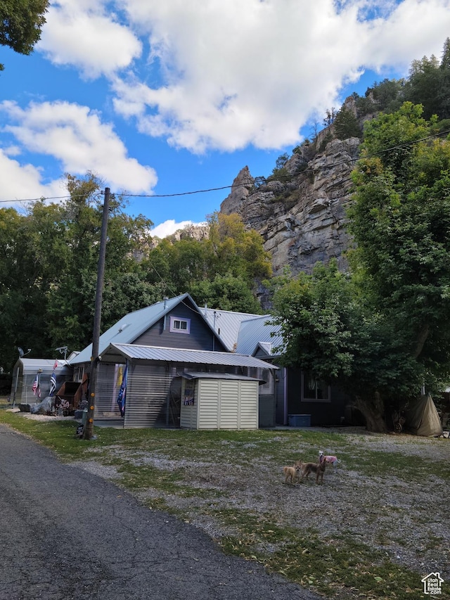 83 E Miners St, Ophir, UT 84071 - view of front facade with metal roof and cooling unit