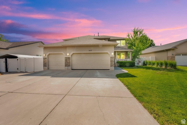 1472 S Via La Costa Way, Kaysville, UT 84037 - view of front of home featuring a garage, stucco siding, stone siding, and driveway