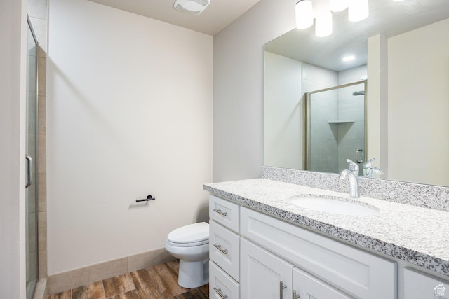 1232 Canyon Rd, Midway, UT 84049 - bathroom featuring wood finished floors, vanity, toilet, and a stall shower