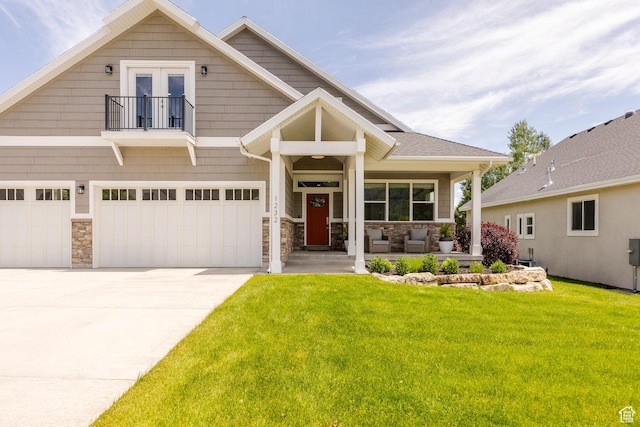 1232 Canyon Rd, Midway, UT 84049 - craftsman inspired home with a balcony, a front lawn, concrete driveway, stone siding, and a garage