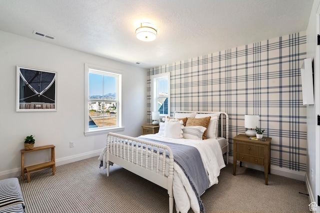 11214 S Easy Bee Rd, South Jordan, UT 84009 - bedroom with baseboards, carpet, a textured ceiling, and wallpapered walls
