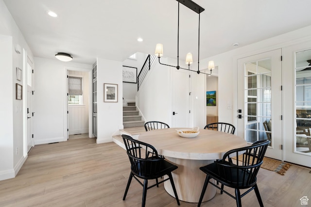 11214 S Easy Bee Rd, South Jordan, UT 84009 - dining area with light wood-type flooring, stairway, baseboards, a chandelier, and recessed lighting