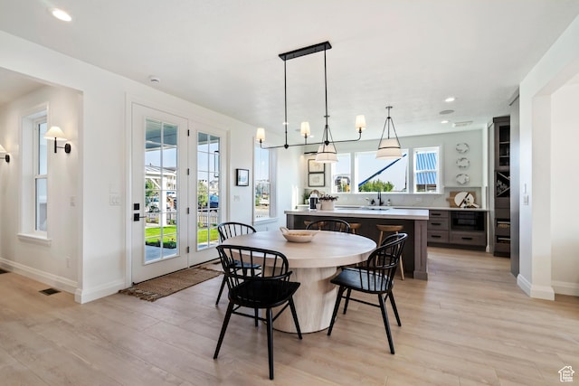 11214 S Easy Bee Rd, South Jordan, UT 84009 - dining space featuring light wood-style floors, baseboards, and recessed lighting