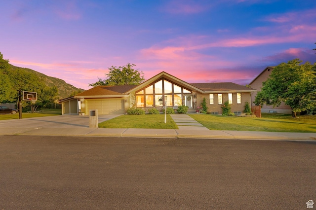 698 E 2320 N, Provo, UT 84604 - ranch-style home with an attached garage, a yard, driveway, and a mountain view